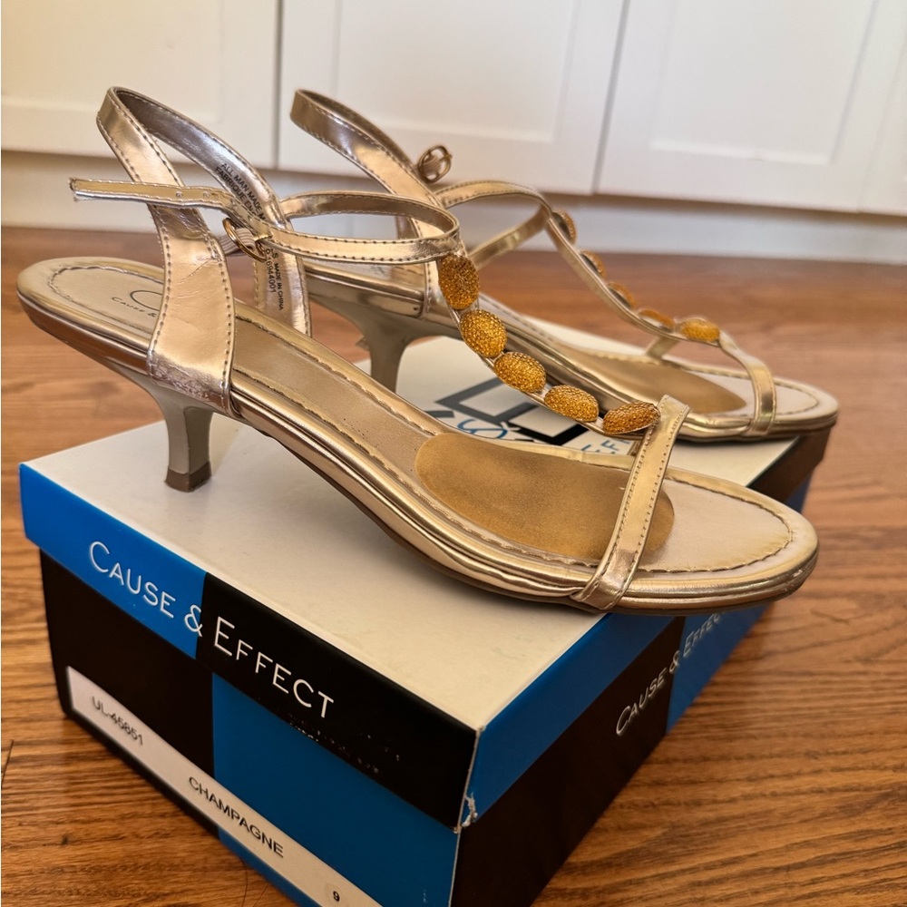 Lightly worn gold kitten heels with jewelled detail